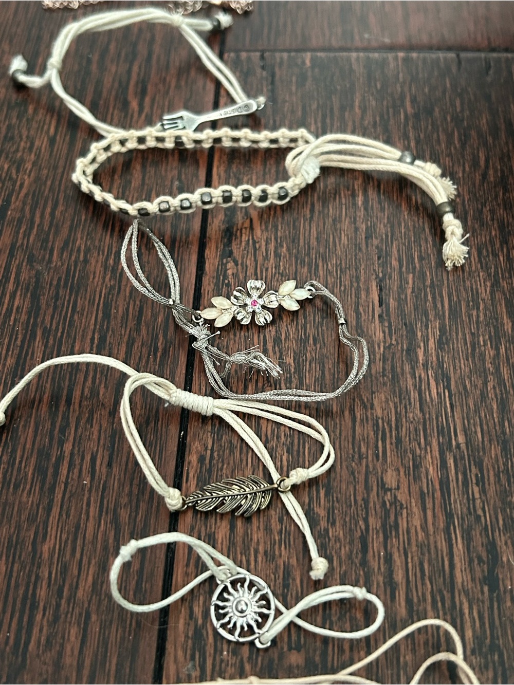 Delicate Cream Cord Bracelet with Silver Floral and Feather Charms